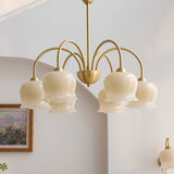 morup-elegant-floral-brass-and-resin-chandelier-with-shimmering-arches-and-cream-accents