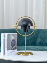 modern-sculptural-spherical-table-lamp-with-adjustable-metal-shades-and-copper-finish