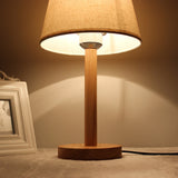 minimalist-nordic-wooden-bedside-lamp-with-white-fabric-drum-shade-for-modern-home