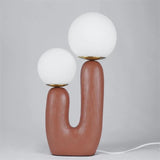 modern-resin-globe-table-lamp-with-sculptural-base-for-designer-home-decor