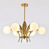 modern-ophelia-glass-globe-chandelier-with-wrought-iron-and-feather-detail-in-antique-gold