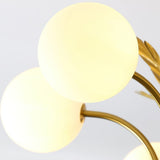modern-ophelia-glass-globe-chandelier-with-wrought-iron-and-feather-detail-in-antique-gold