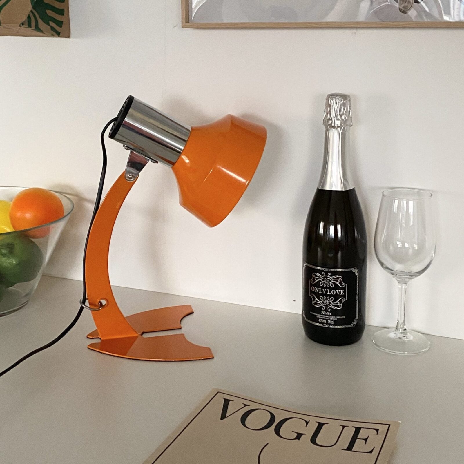 stylish-orange-and-chrome-metal-bedside-lamp-with-vibrant-apple-green-wire