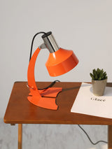stylish-orange-and-chrome-metal-bedside-lamp-with-vibrant-apple-green-wire