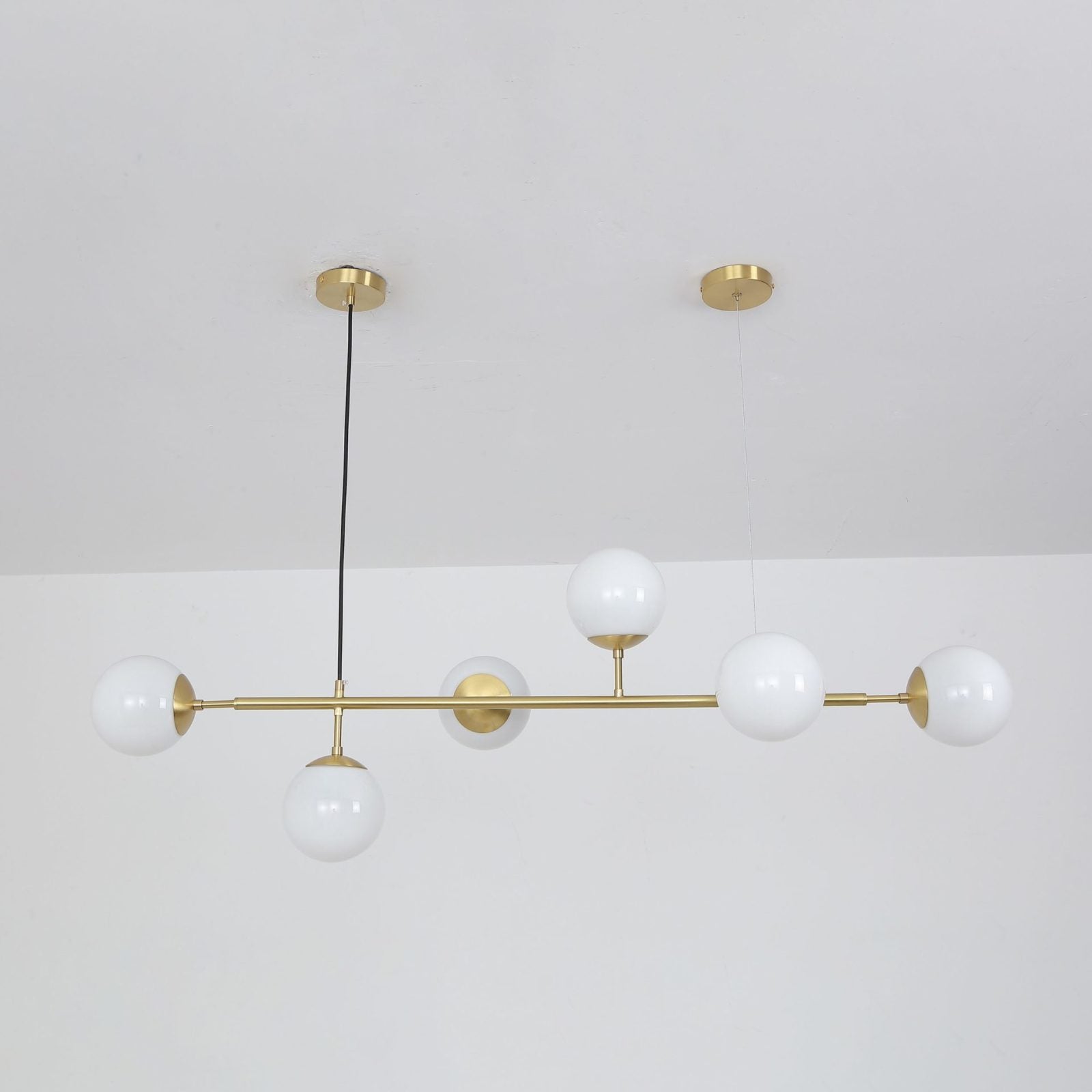 contemporary-multi-glass-globe-pendant-light-with-round-orb-shades-and-polished-brass-frame