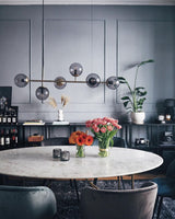 contemporary-multi-glass-globe-pendant-light-with-round-orb-shades-and-polished-brass-frame