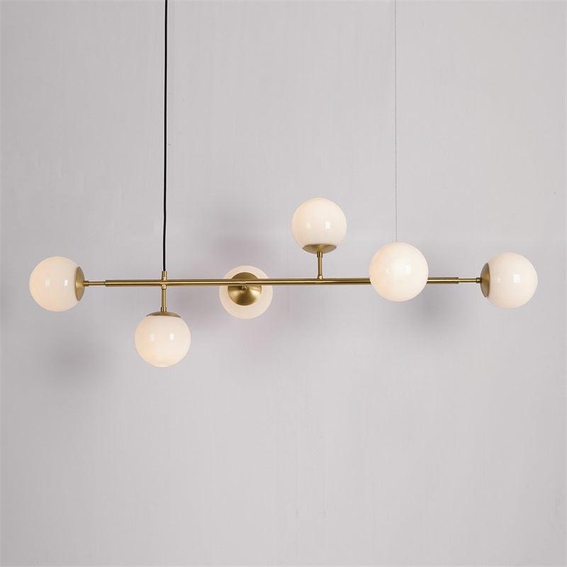 contemporary-multi-glass-globe-pendant-light-with-round-orb-shades-and-polished-brass-frame