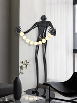 Modern Orb Juggler Sculpture Floor Lamp Artistic LED Uplight for Contemporary Living Rooms