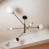 modern-orbital-3-arm-articulated-glass-globe-chandelier-in-copper-and-bronze-finish