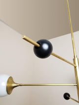 modern-orbital-3-arm-articulated-glass-globe-chandelier-in-copper-and-bronze-finish
