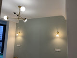 modern-orbital-3-arm-articulated-glass-globe-chandelier-in-copper-and-bronze-finish