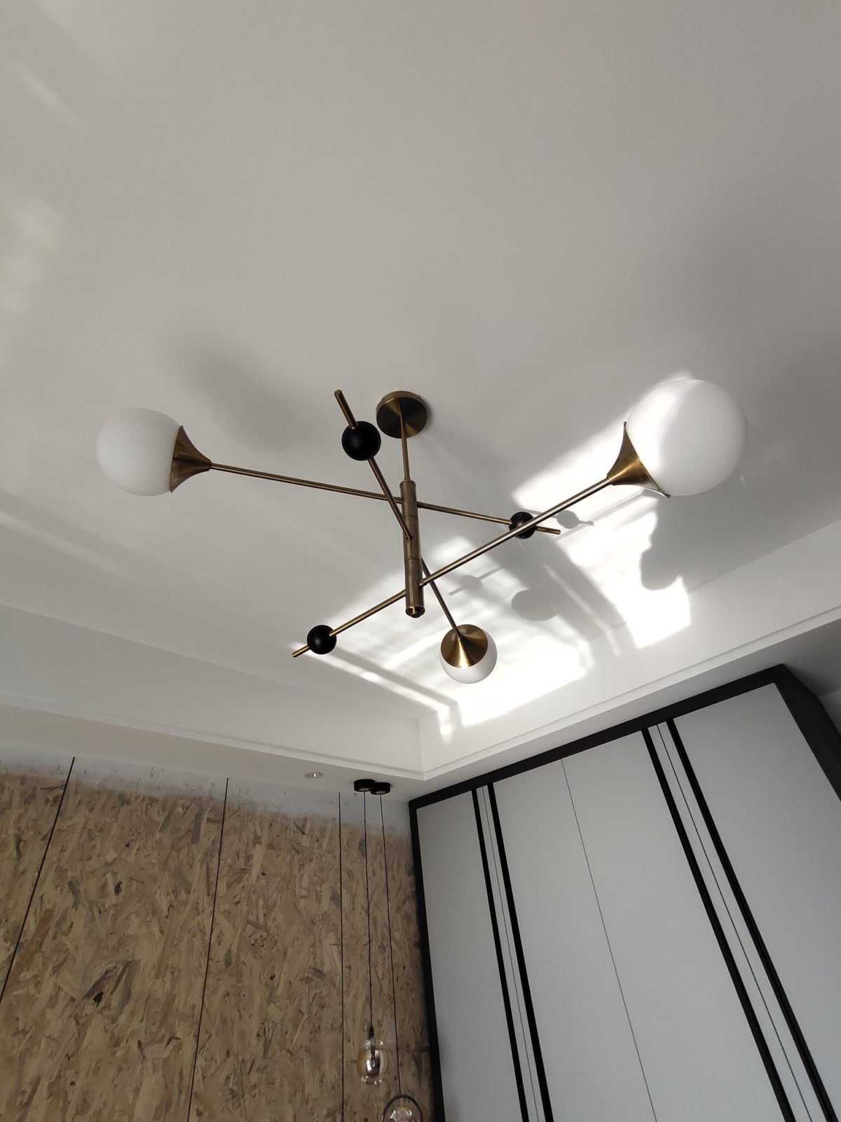 modern-orbital-3-arm-articulated-glass-globe-chandelier-in-copper-and-bronze-finish