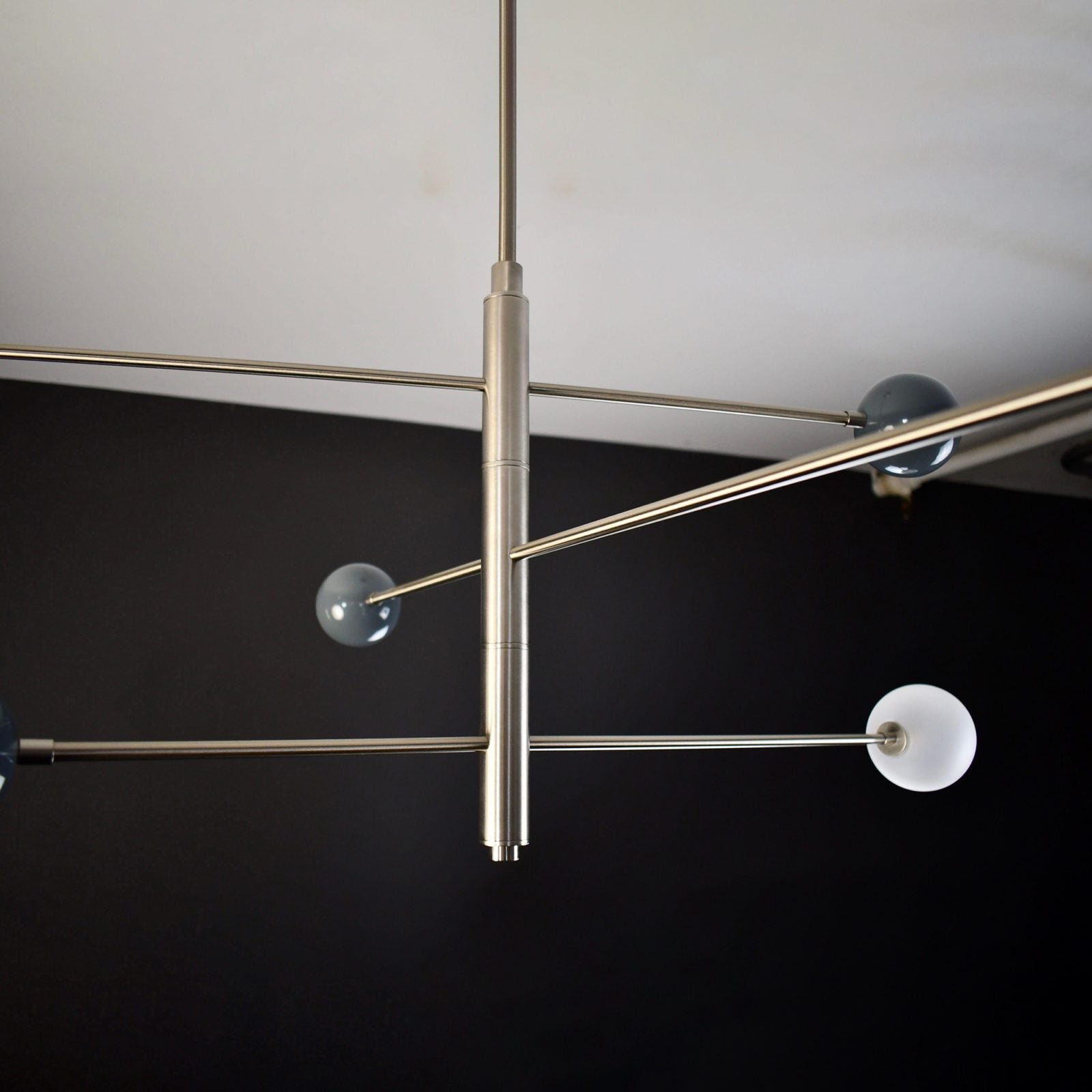 modern-orbital-3-arm-articulated-glass-globe-chandelier-in-copper-and-bronze-finish