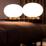 Modern Orbiting Sphere LED Table Lamp with Gold Finish and Frosted Glass Globe for Desk