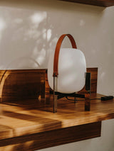 Modern Portable Lantern Table Lamp with Leather Handle and Opal Glass Globe for Bedside Lighting