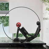 Modern Figurative Reader Sculpture LED Floor Lamp with Circular Frame and Ambient Lighting