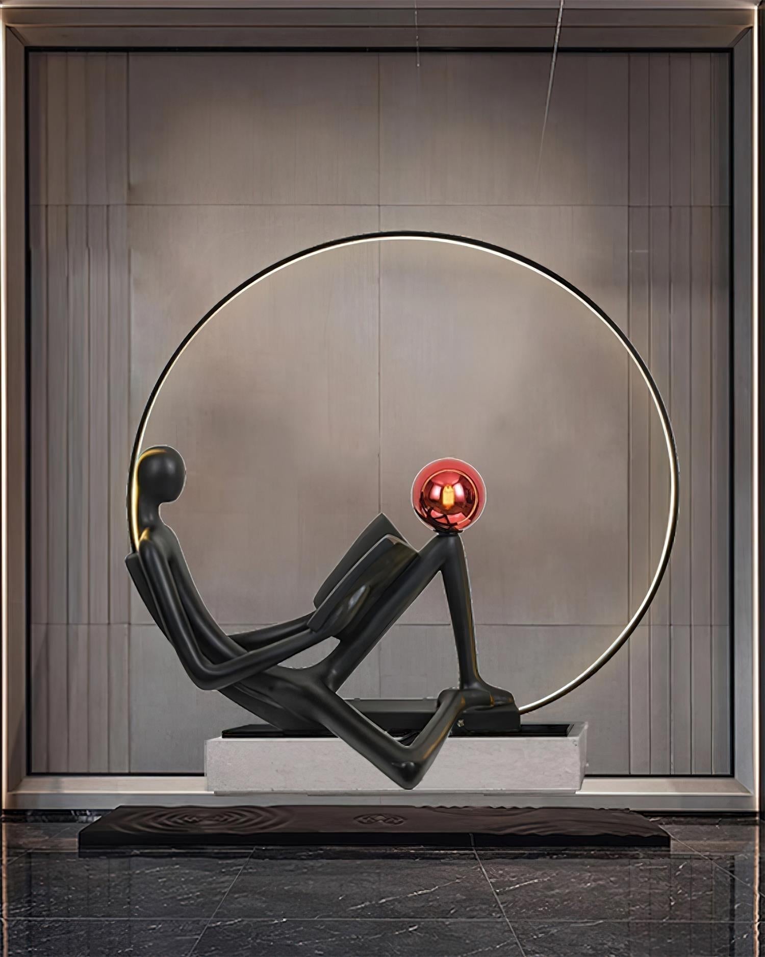Modern Figurative Reader Sculpture LED Floor Lamp with Circular Frame and Ambient Lighting