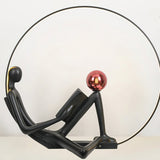 Modern Figurative Reader Sculpture LED Floor Lamp with Circular Frame and Ambient Lighting