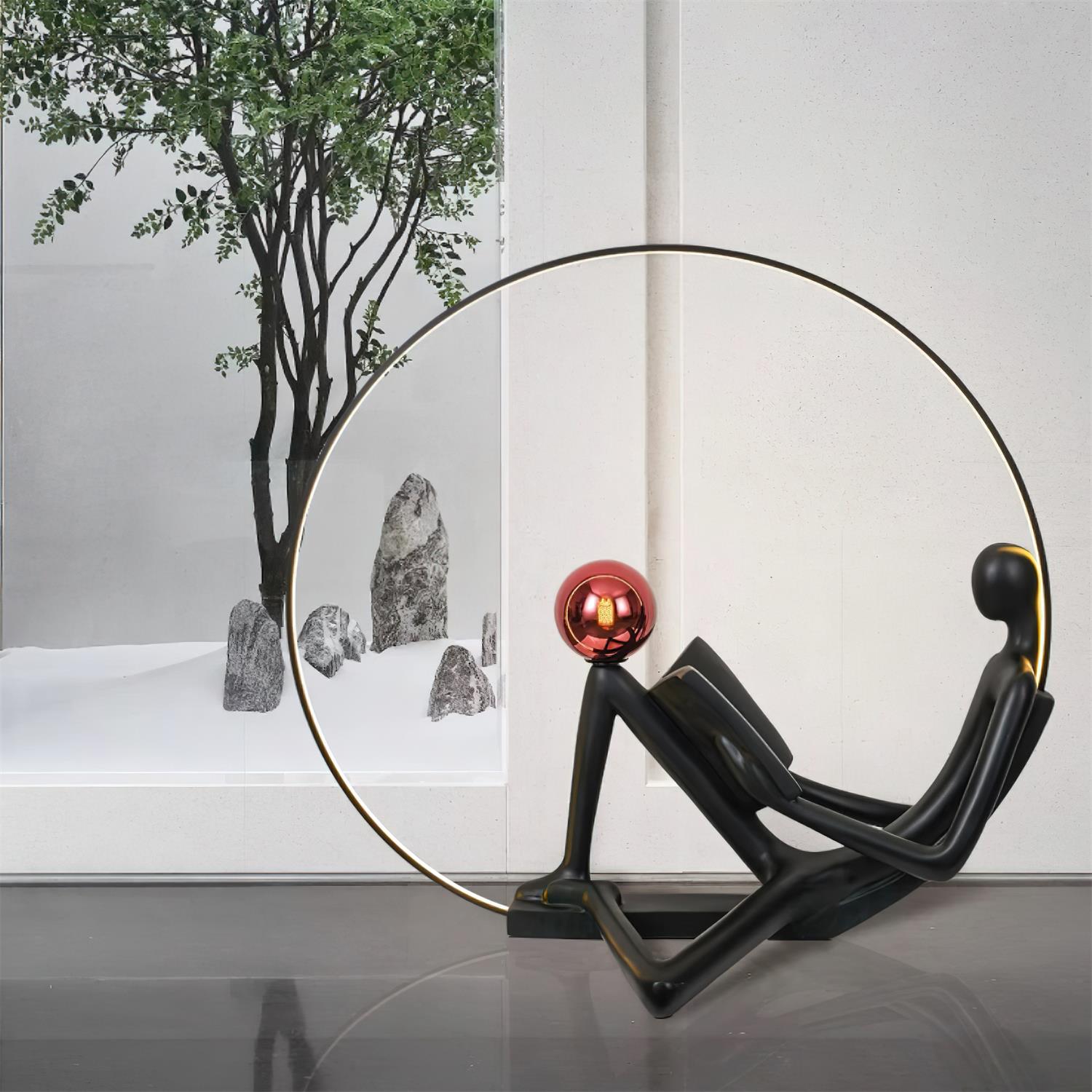 Modern Figurative Reader Sculpture LED Floor Lamp with Circular Frame and Ambient Lighting