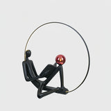 Modern Figurative Reader Sculpture LED Floor Lamp with Circular Frame and Ambient Lighting