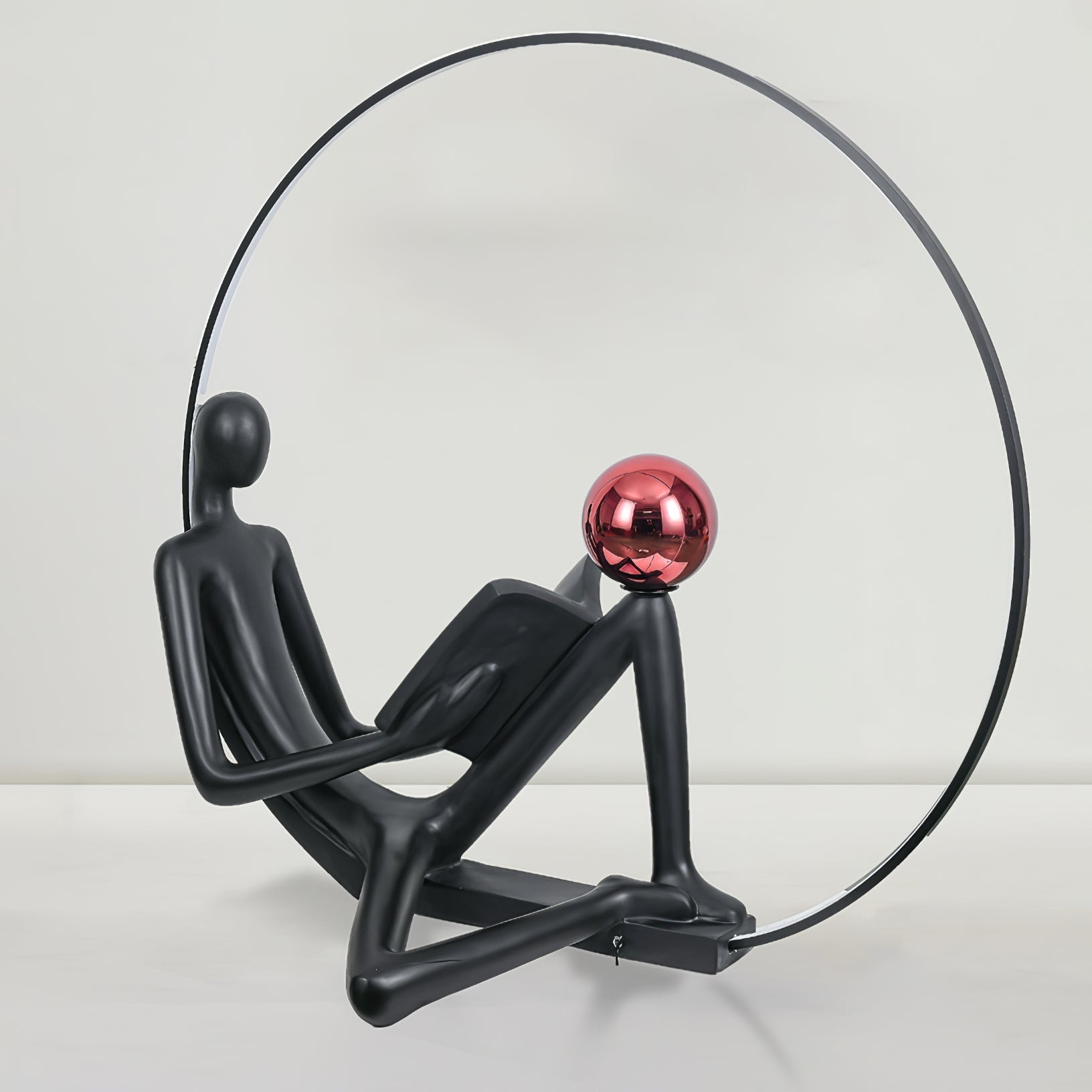 Modern Figurative Reader Sculpture LED Floor Lamp with Circular Frame and Ambient Lighting