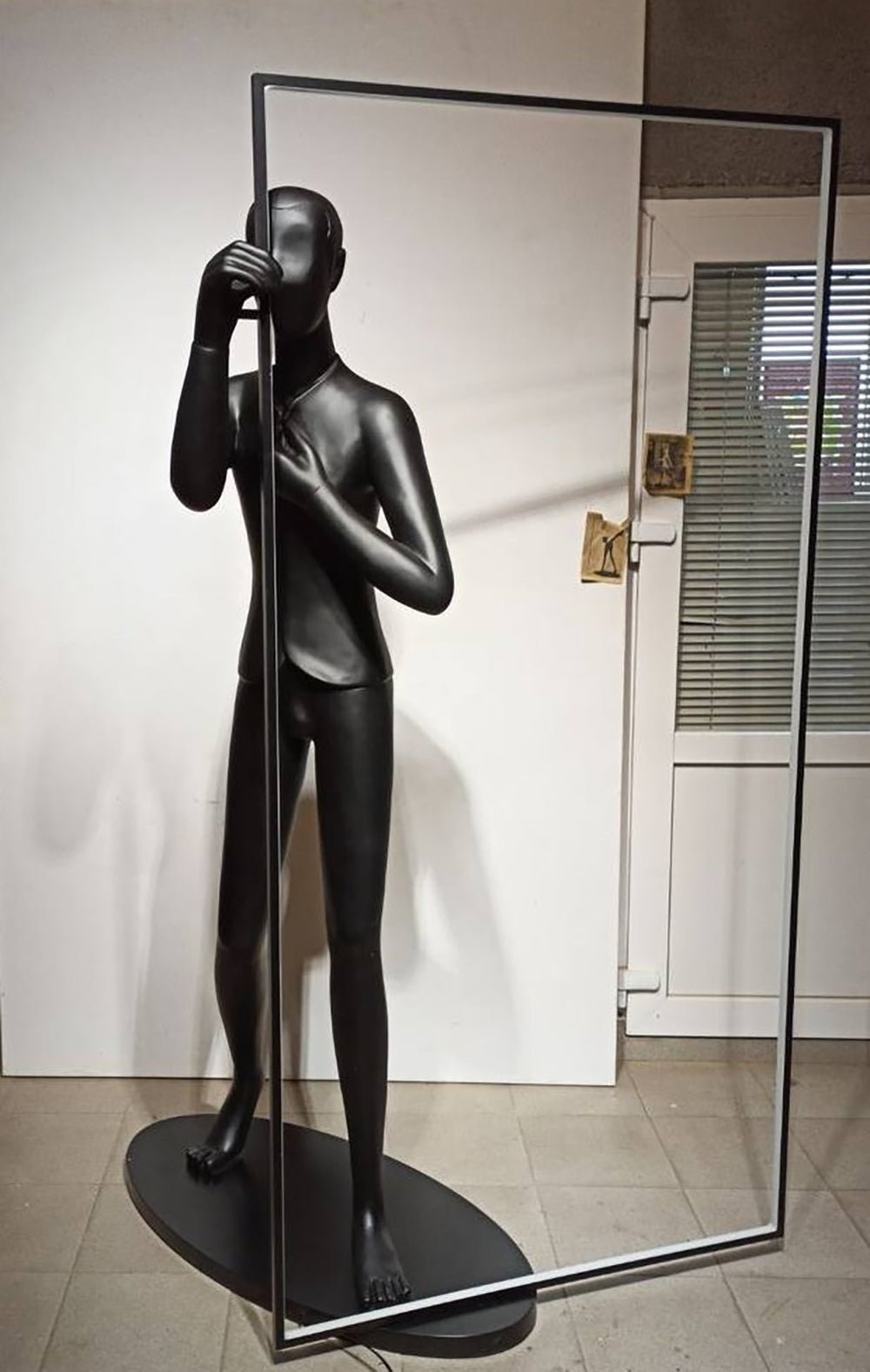 modern-figurative-sculpture-floor-lamp-with-integrated-mirror-and-led-lighting-for-artistic-interiors