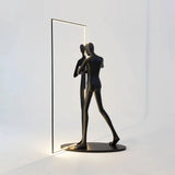 modern-figurative-sculpture-floor-lamp-with-integrated-mirror-and-led-lighting-for-artistic-interiors