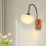elegant-walnut-wood-wall-lamp-with-white-glass-globe-shade-for-indoor-lighting