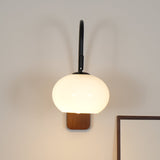 elegant-walnut-wood-wall-lamp-with-white-glass-globe-shade-for-indoor-lighting