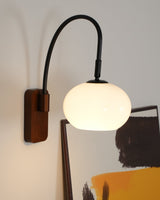elegant-walnut-wood-wall-lamp-with-white-glass-globe-shade-for-indoor-lighting