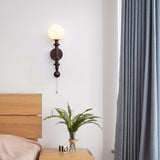 vintage-roman-column-wall-sconce-with-walnut-wood-accents-and-glass-shade-for-indoor-lighting