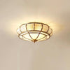 Modern Brass Flush Mount Ceiling Light with Textured Glass Shade for Indoor Spaces