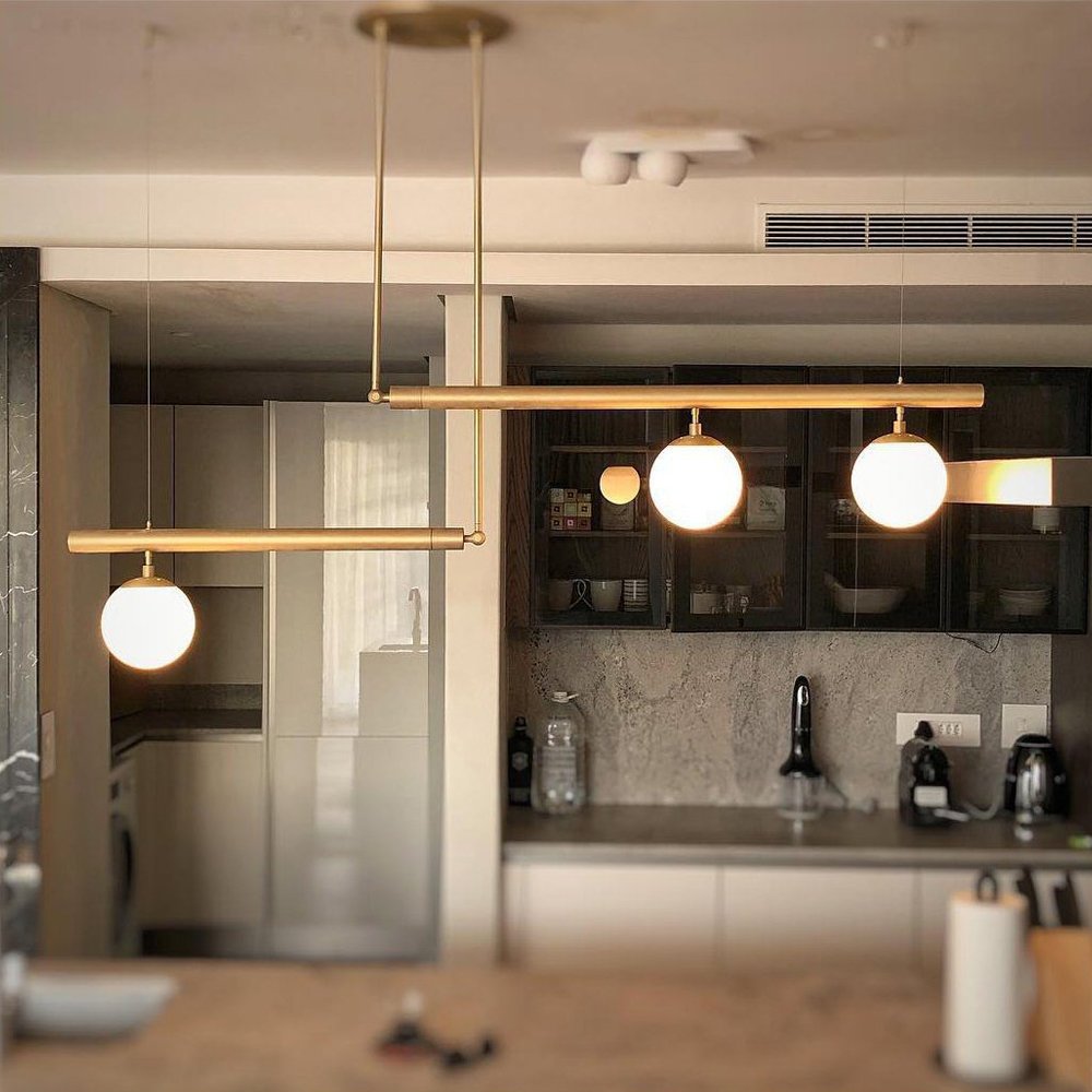 modern-geometric-satellite-pendant-light-with-opal-glass-globes-and-adjustable-brass-arms