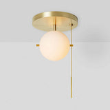 modern-signal-brass-ceiling-light-with-hand-blown-glass-globe-and-pull-switch