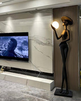 contemporary-sculpture-floor-lamp-with-fiberglass-body-and-glass-globe-shade-for-luxury-interiors