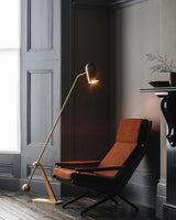 modern-stasis-floor-lamp-with-adjustable-copper-shade-and-brass-base