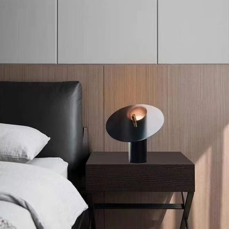 modern-interactive-glass-disc-table-lamp-with-rotating-brass-shaft-and-dimming-control