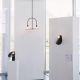 modern-interactive-glass-disc-table-lamp-with-rotating-brass-shaft-and-dimming-control
