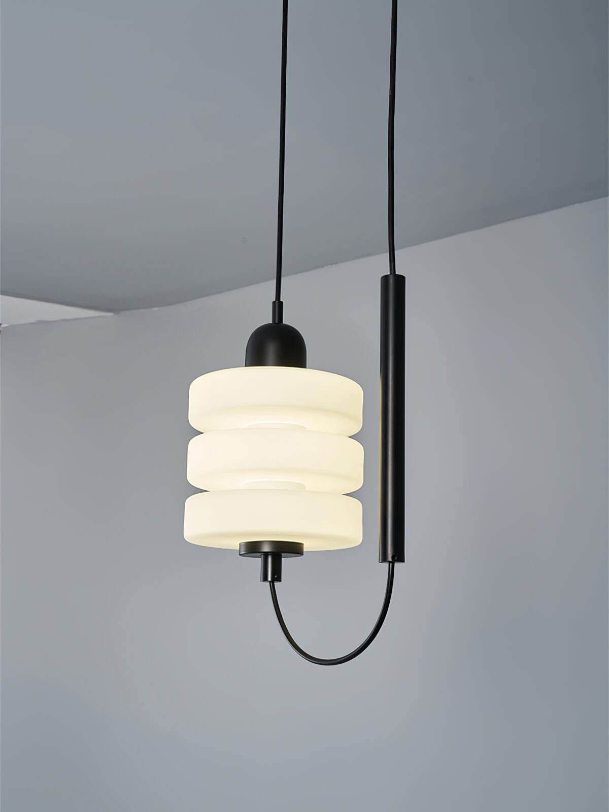 modern-triple-puck-led-pendant-light-with-ice-glazed-glass-diffuser-and-machined-iron-base