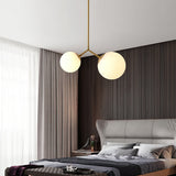 modern-asymmetric-glass-globe-pendant-light-with-brass-accents-and-hand-blown-glass