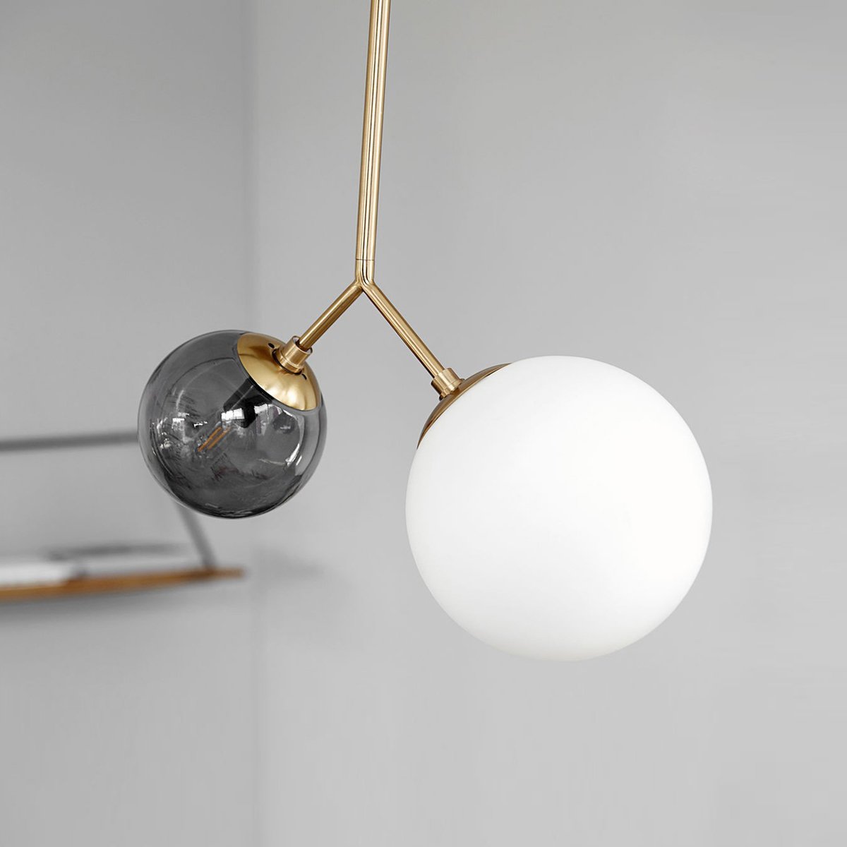 modern-asymmetric-glass-globe-pendant-light-with-brass-accents-and-hand-blown-glass