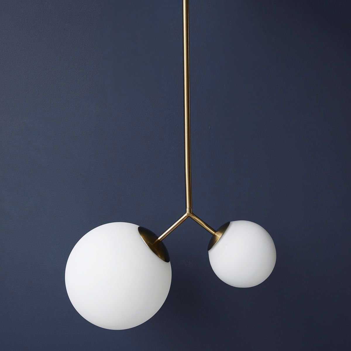 modern-asymmetric-glass-globe-pendant-light-with-brass-accents-and-hand-blown-glass