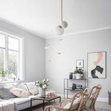 modern-asymmetric-glass-globe-pendant-light-with-brass-accents-and-hand-blown-glass