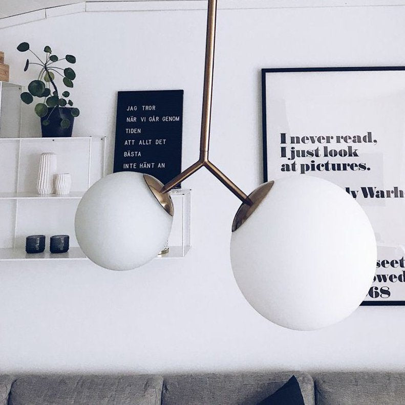 modern-asymmetric-glass-globe-pendant-light-with-brass-accents-and-hand-blown-glass