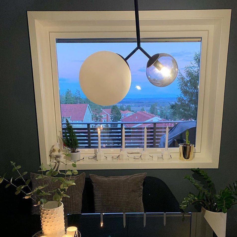 modern-asymmetric-glass-globe-pendant-light-with-brass-accents-and-hand-blown-glass