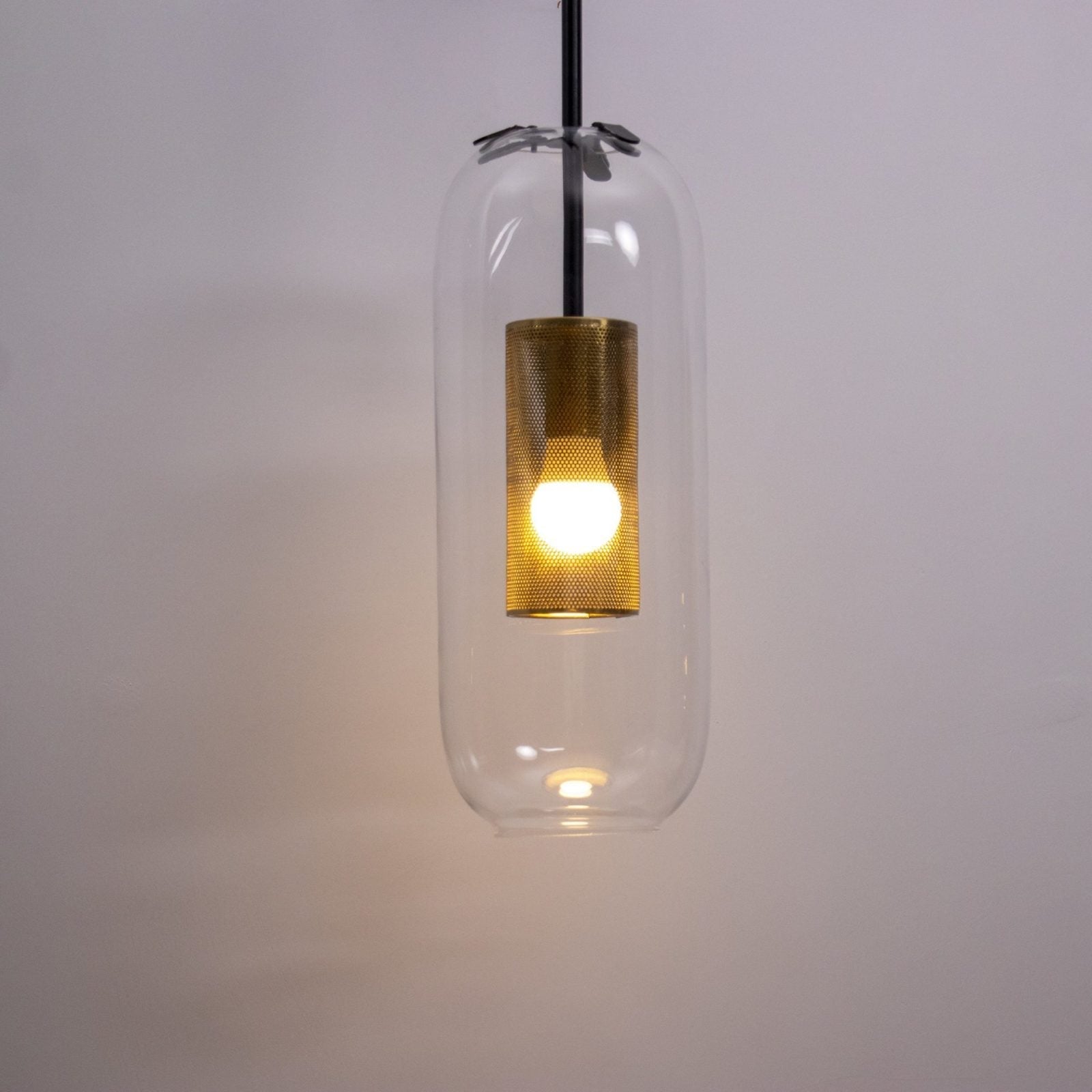 modern-vadim-glass-wall-sconce-with-perforated-metal-cage-and-brass-finish-for-luxury-interiors