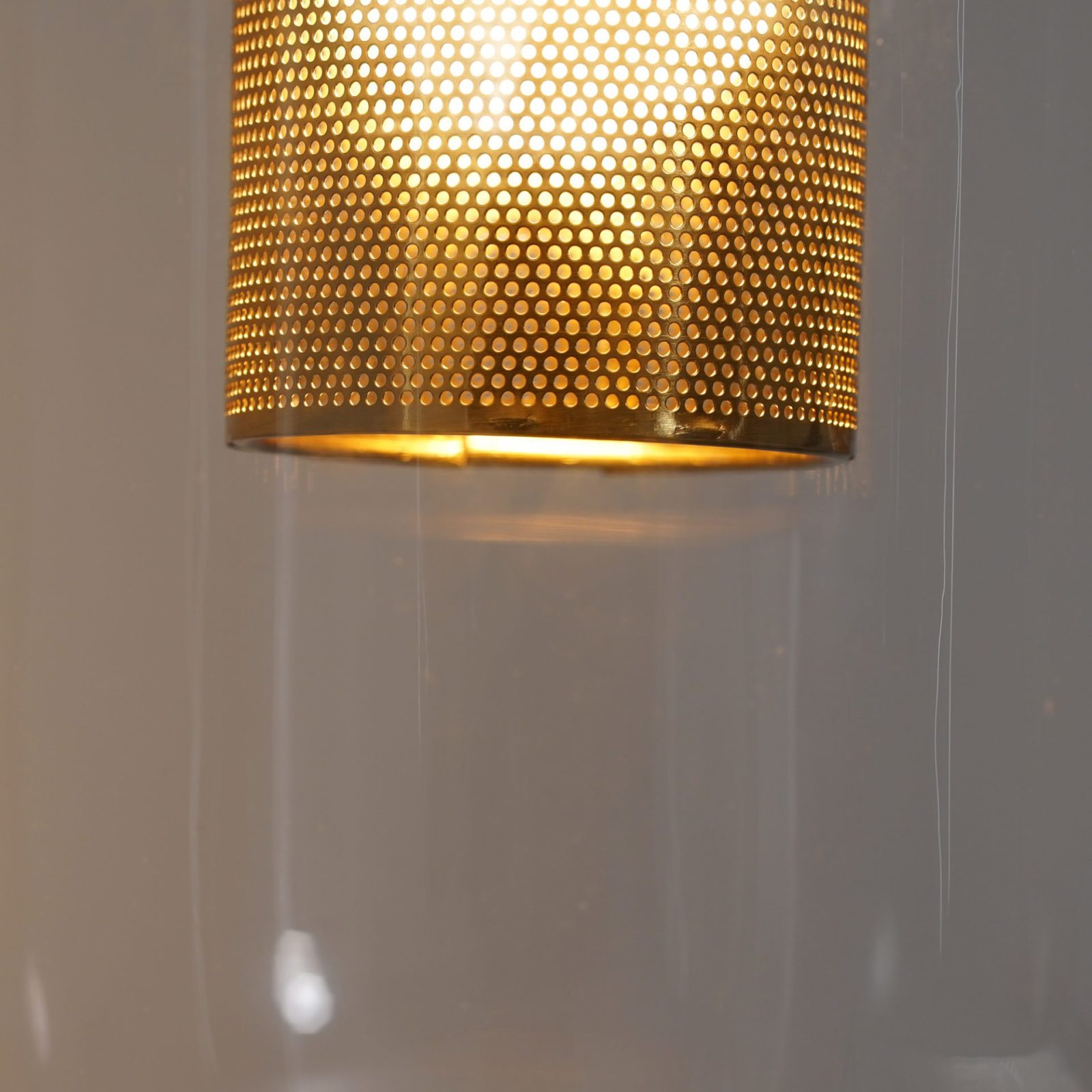 modern-vadim-glass-wall-sconce-with-perforated-metal-cage-and-brass-finish-for-luxury-interiors