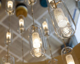 vadim-modern-glass-globe-pendant-light-with-gold-steel-rod-and-perforated-cage