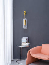 modern-vadim-glass-wall-sconce-with-perforated-metal-cage-and-brass-finish-for-luxury-interiors