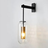 modern-vadim-glass-wall-sconce-with-perforated-metal-cage-and-brass-finish-for-luxury-interiors